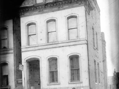 File:Two men standing in front of house for sale, sign reading A. Morgenstern, Mohel.jpg