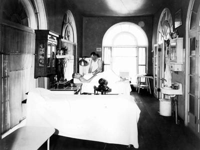 File:Black & white print; building interior; Quapaw Bathhouse interior, men's massage room; masseur treating patron; shows equipment (eacfc7cc-9406-447e-9a00-146884ee6f8b).tif