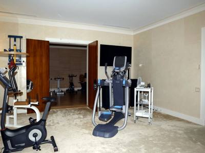 File:EFTA00000258 - Well-equipped home gym featuring exercise bikes an elliptical machine and a television screen.jpg