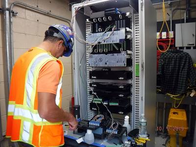 File:Splicing fiber optic cables in a communications cabinet in a power facility in Queens. 10-02-2019 (48844065016).jpg